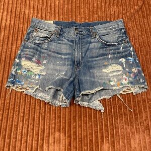 Mid-wash paint splatter shorts